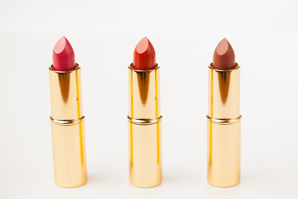 three lipsticks on white background - Fotó, kép