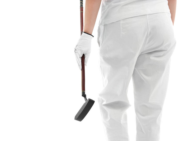 Woman holding golf club on white background - Foto, Imagen