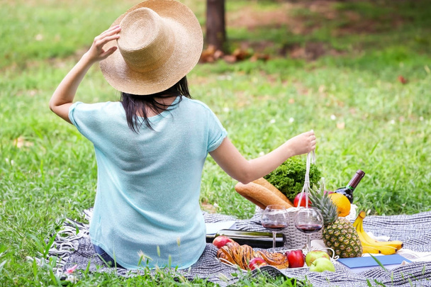 Woman on picnic in park - Фото, зображення