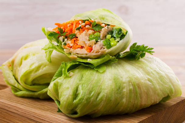 Lettuce wraps with chicken, carrot, peanuts and ginger-scallion oil, - Photo, Image