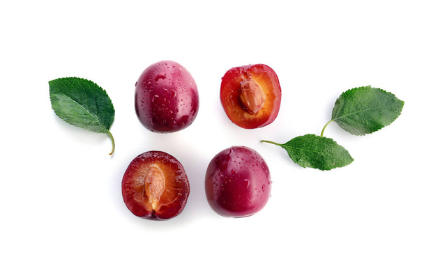 Ripe fresh plums on white background - Foto, Imagen