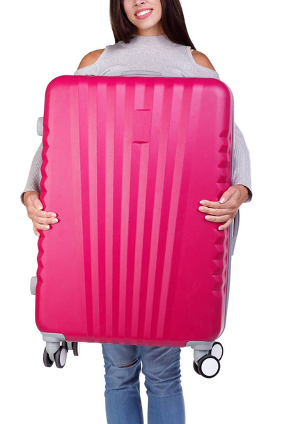 Big pink suitcase in womans hand isolated on a white background. - Foto, Bild