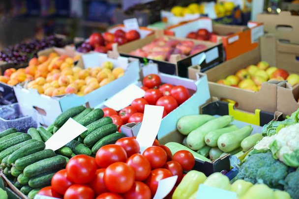 Assortment of fresh vegetables and fruits at market - 写真・画像