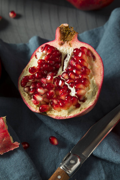 Raw Red Organic Pomegranates - Фото, изображение