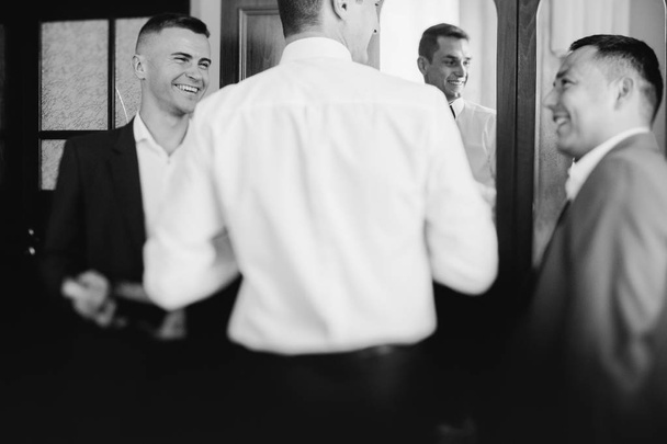 groomsmen helping happy groom  - Φωτογραφία, εικόνα
