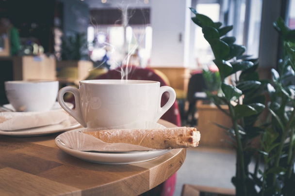 White cup of coffee at the cafe interior - Φωτογραφία, εικόνα