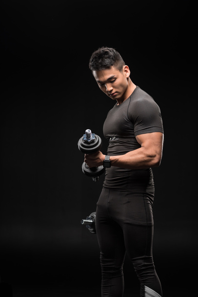 muscular man with dumbbells - Photo, image