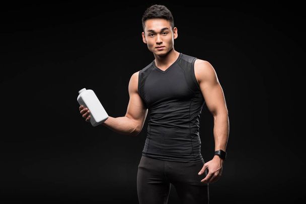 muscular man with sport nutrition - Fotoğraf, Görsel
