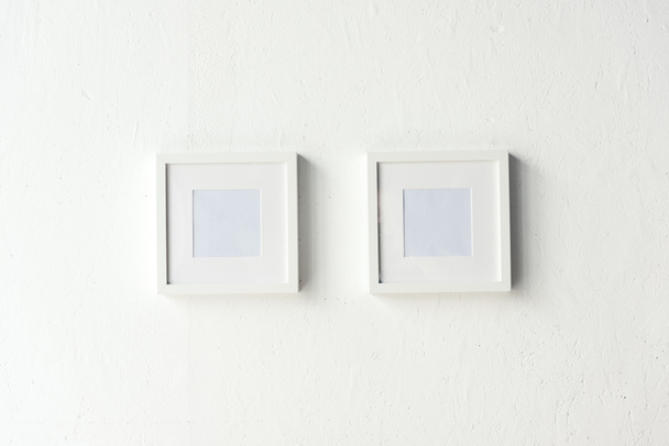 empty photo frames hanging on wall - Photo, Image