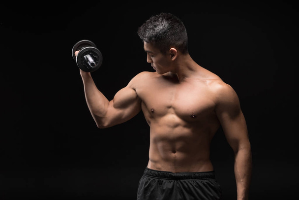 muscular man with dumbbell  - Photo, Image