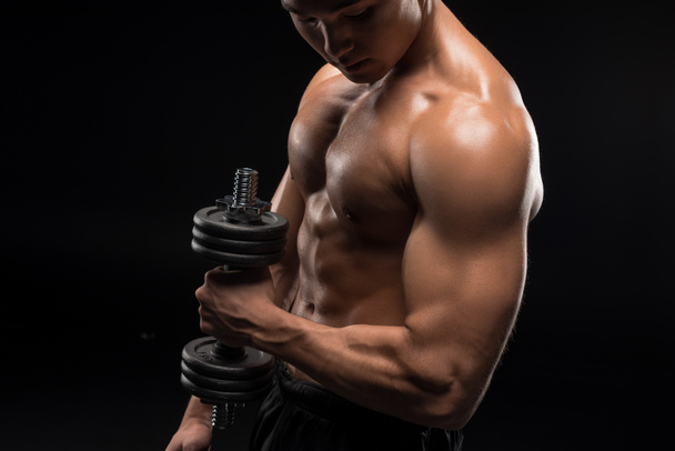 muscular man with dumbbell  - Foto, immagini
