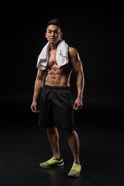 muscular asian man with towel - Photo, image