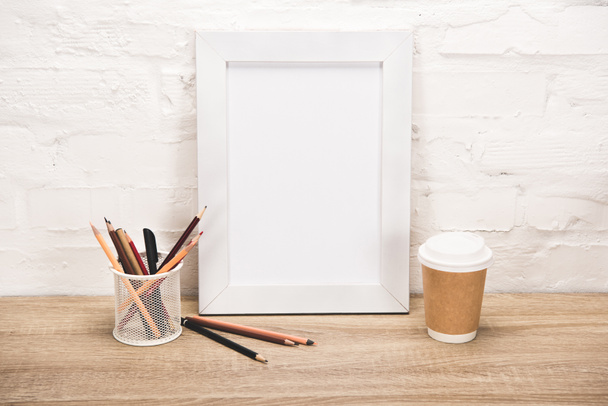 photo frame and coffee to go on table - Fotografie, Obrázek