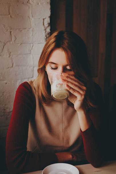 woman with cup of latte coffee  - Фото, зображення