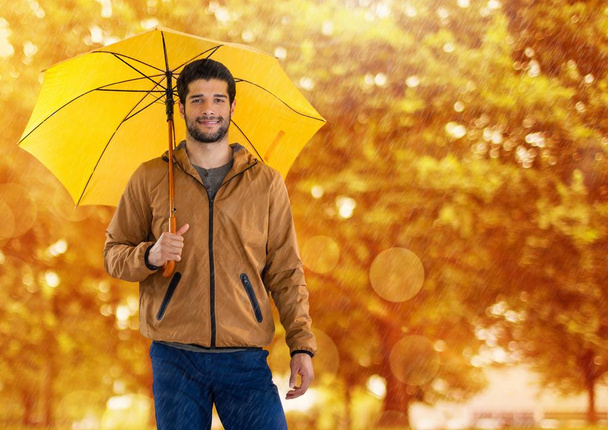 Man in Autumn with umbrella in forest - Zdjęcie, obraz