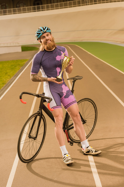 Radfahrer mit Meisterpokal - Foto, Bild