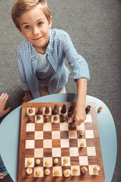 boy playing chess - Фото, изображение