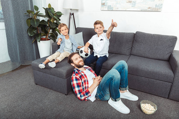 father with sons spending time at home - Foto, immagini