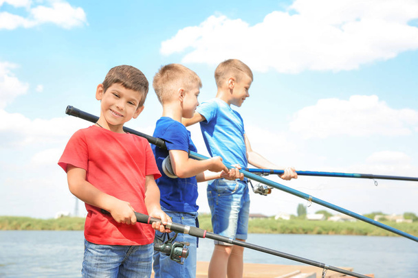 Cute children fishing on summer day - 写真・画像