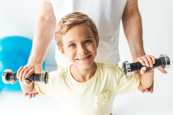 father and son training with dumbbells - Photo, Image
