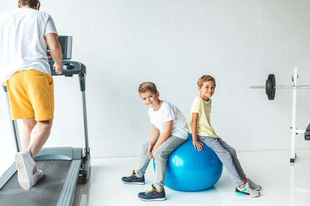 father with sons exercising together - Photo, Image