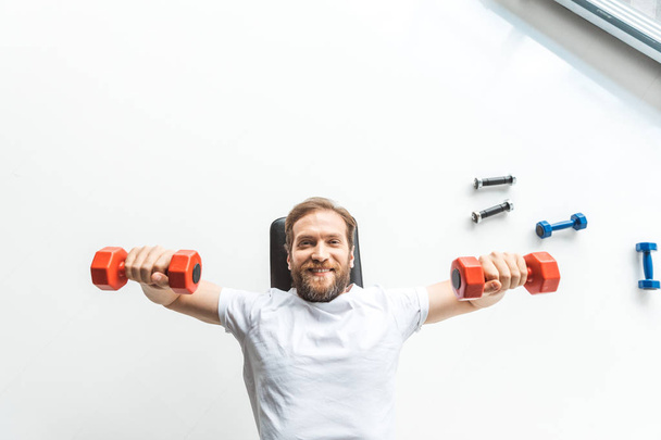 man exercising with dumbbells  - Fotó, kép