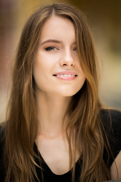 Portrait of young beautiful woman with long hair. - 写真・画像