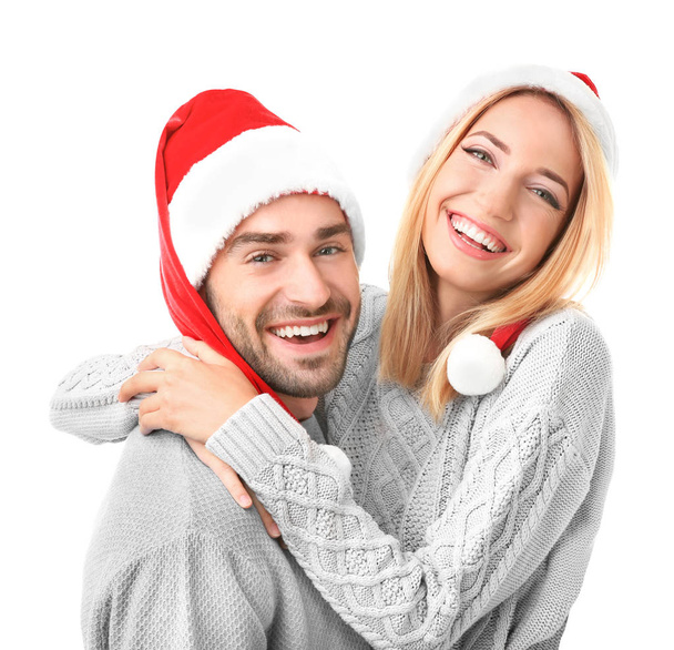 young couple in Santa hats - Valokuva, kuva
