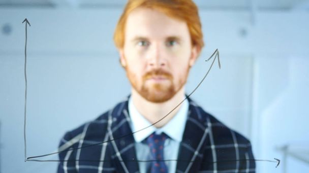 Looking in Camera, Growth Graph on Transparent Glass in Office, Red Hairs - Photo, Image
