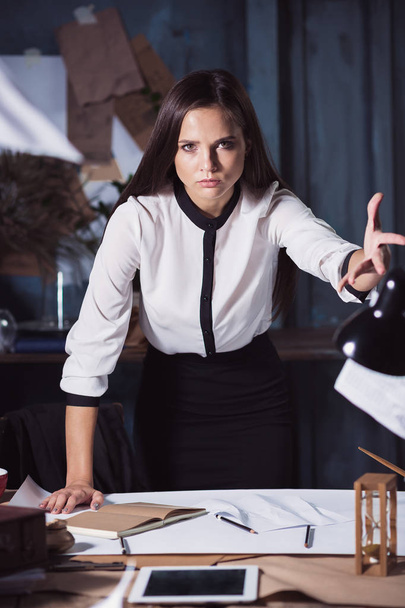 Young business woman throwing documents at camera. - Fotografie, Obrázek