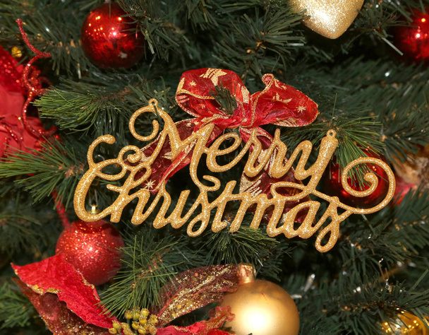 gleaming golden text Merry Christmas for decorating the house du - Photo, Image