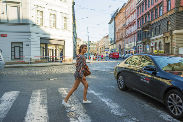 pedestrian crosses street in crosswalk. - Fotoğraf, Görsel