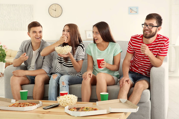 Friends watching TV at home - Фото, зображення