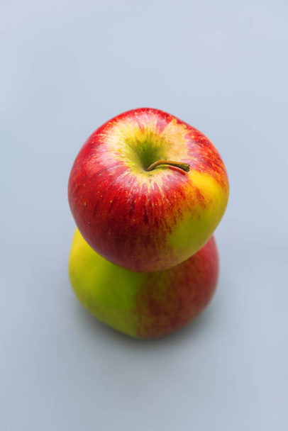 Two apples on a blue background - Photo, Image