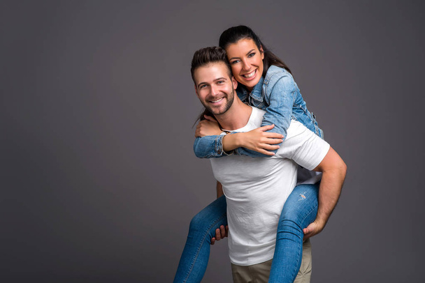 Nice young couple in the studio   - Foto, afbeelding