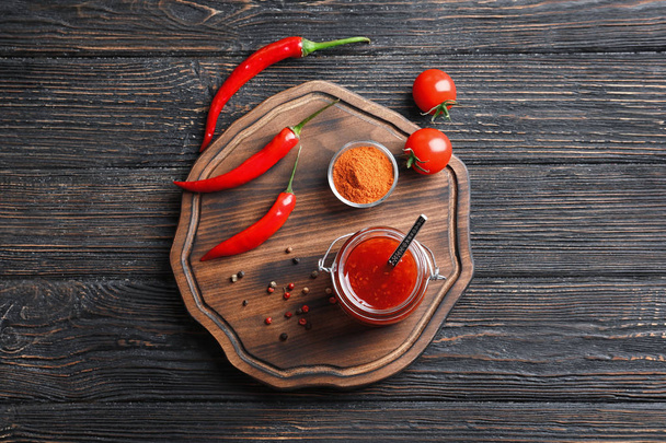 Composition with chili sauce - Foto, afbeelding