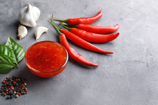Composition with chili sauce - Foto, afbeelding