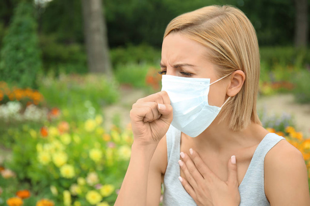 Young woman with allergy outdoors - Foto, Imagen