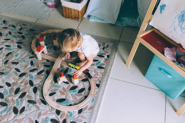 baby playing with toy railway - Foto, Imagen