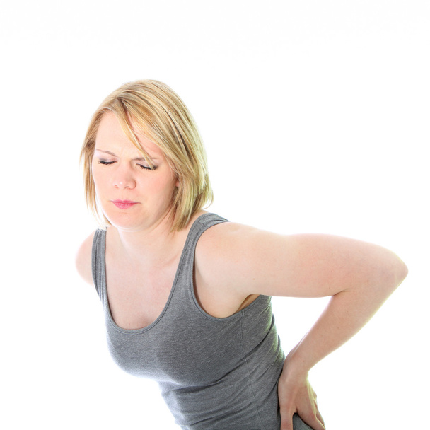Young woman with back pain - Photo, Image