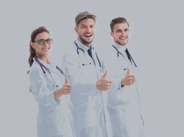 Team of medical professionals  looking at camera, showing thumbs - Photo, image