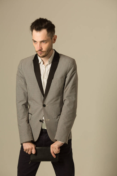 a young man in a suit with an unshaven face - Photo, Image