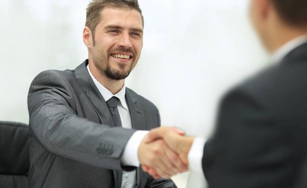 closeup .handshake of business partners on a Desk - Fotoğraf, Görsel