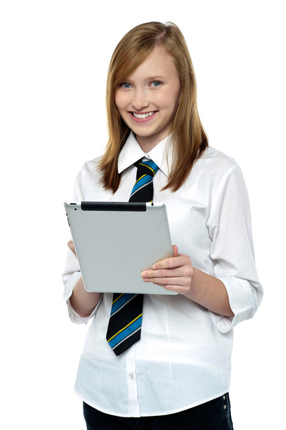Gorgeous teenager browsing on her tablet pc - Fotografie, Obrázek