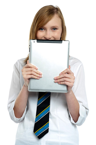 Shy girl hiding her face with a tablet device - Φωτογραφία, εικόνα