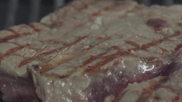 Close-up pan around half-fried stake - Кадры, видео