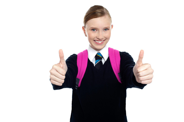 Bright student showing thumbs up sign - Zdjęcie, obraz