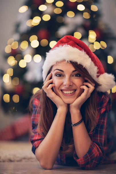 Girl with Santa Clause cap at Christmas eve - Foto, Imagem