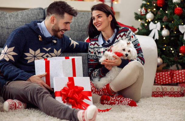 Christmas time- girl getting puppy for Christmas - Foto, imagen