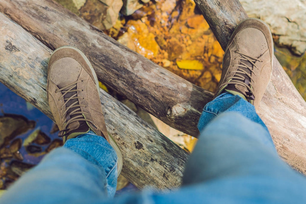Feet trekking boots hiking Traveler alone outdoor wild nature Lifestyle Travel extreme survival concept summer adventure vacations steps sole - 写真・画像